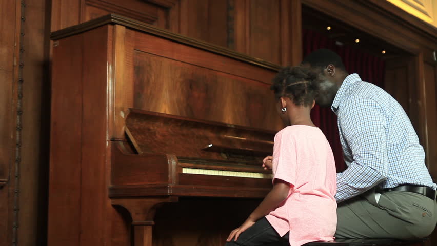 Father and daugther playing piano | Shutterstock HD Video #11885942