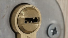 Man Inserts a Key into the Door Lock and Open or Close It. Full HD 1920x1080 Video Clip