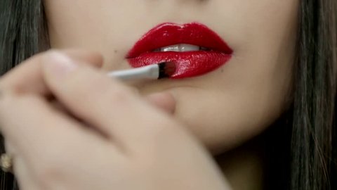 Macro closeup of sexy woman with red lips flirting seductive