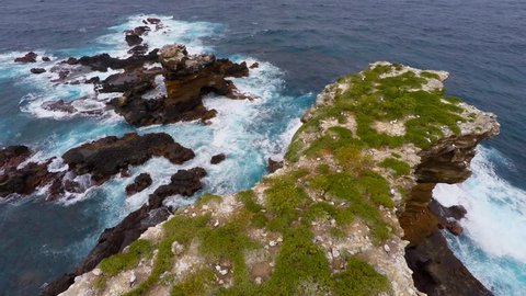  Aerial shot over Darwin Arc an iconic rock  in Galapagos island