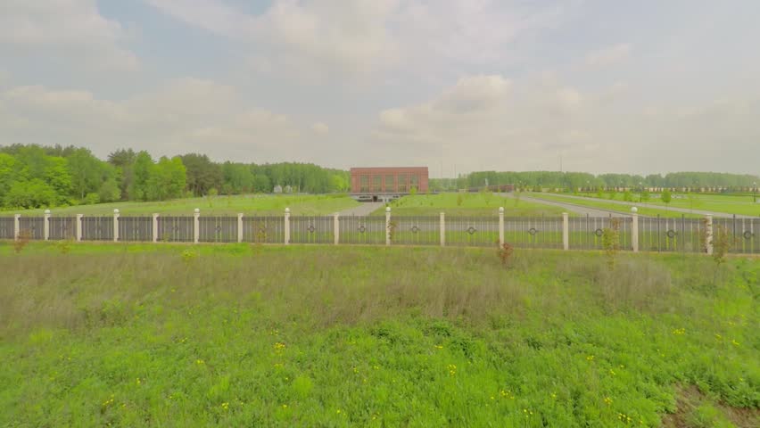 Fenced territory of Federal Memorial Cemetery at spring cloudy day. Aerial view