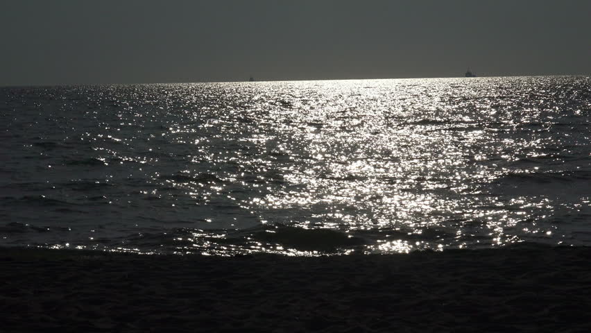 Group of Three Teenage Girls Run Into The Water, Silhouette having fun and celebrate On The Beach At Sunset