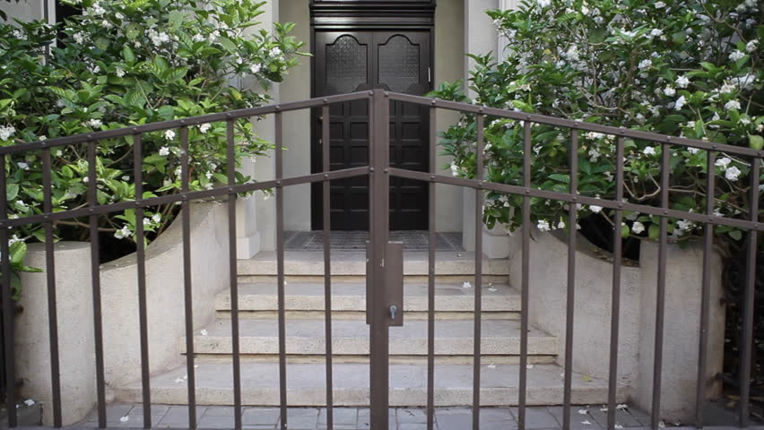 Old renovated house doors, tilt up, white city Tel-Aviv