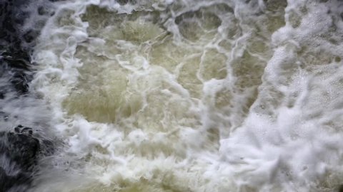 Foamy water of a waterfall