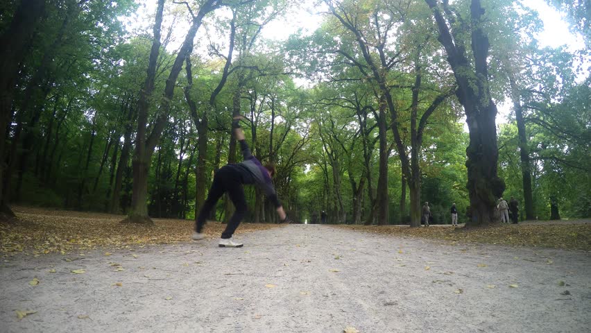 Youg dancer dancing breakdance in the parks