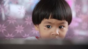 Baby Asian girl playing tablet, video HD