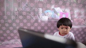 Baby Asian girl playing tablet, video HD