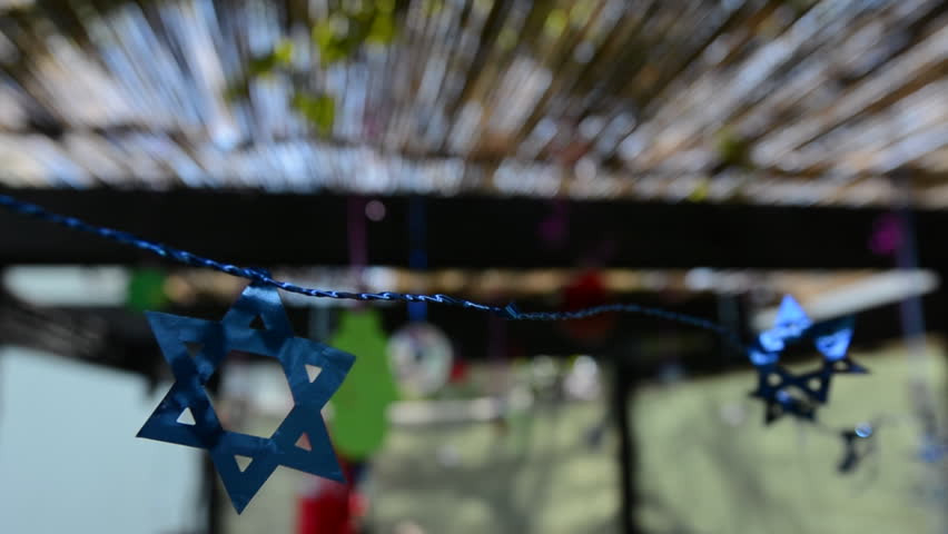 Star of David decorations inside a Jewish family Sukkah for the Jewish festival of Sukkot. A Sukkah is a temporary structure where meals are taken for the week.