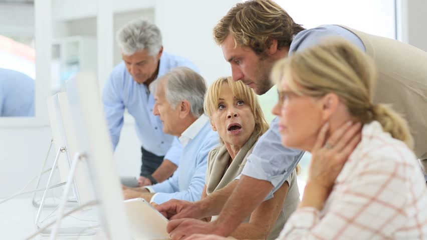 Senior people with trainer working on desktop  Royalty-Free Stock Footage #11917112