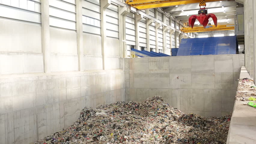 Inside of a new modern waste plant. Pile of waste rwady to be processed in energy. Royalty-Free Stock Footage #11926307