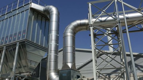 New modern industrial waste plant pipelines from the outside. Waste-to-energy plant. Produces a combustible fuel commodity, such as methane, methanol, ethanol and synthetic fuels.