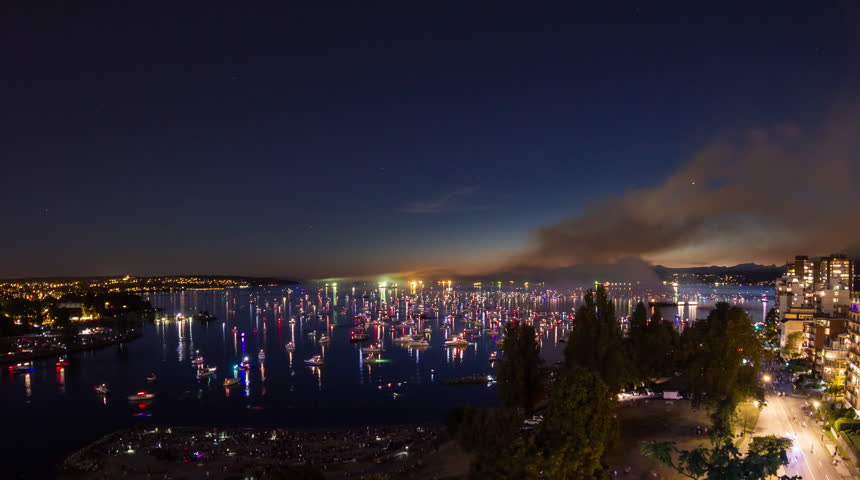 Time lapse of boats and people traffic at night after fireworks event at English Bay in downtown Vancouver, British Columbia, Canada