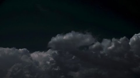 Storm cloud with lighting bolt in the sky at night - Time-lapse