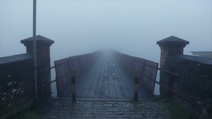 Bridge covered with mist