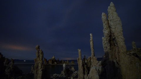 Astrophotography Time-lapse footage of overcast to starry sky over towering tufa formations in Mono Lake, California -Long Shot-