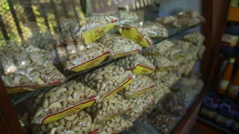 GOA, INDIA - 20 JANUARY 2015: Cashew nuts sorted in plastic bags on shelves.