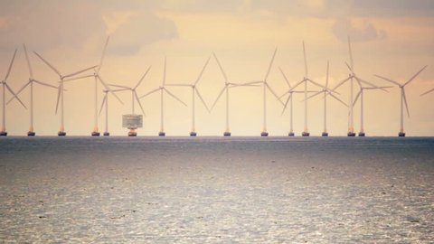 Green energy electricity ocean windfarm sunset Malmo Sweden Copenhagen Denmark