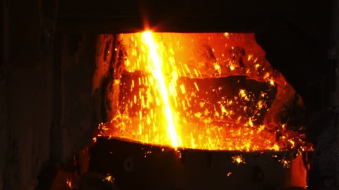 Molten metal melted in furnace at metallurgical plant