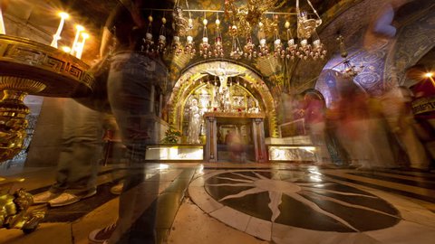 Israel - March, 2011: Sideways tracking footage of pilgrims and tourists at the Golgotha altar in the Church of the Holy Sepulchre in Jerusalem.