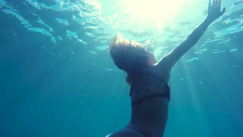 woman bikini swimming underwater towards surface Stock Footage Video ...