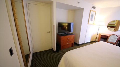 PHILADELPHIA - SEP 2, 2014: Bedroom in Embassy Suites Philadelphia hotel. All-suite hotel located close to Philadelphia main business hubs