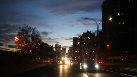 Movement on night road with cars in New York, United States