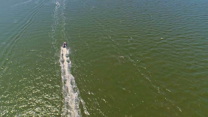 Boat sailing through a lagoon by the ocean
