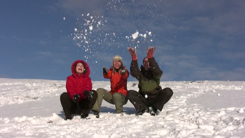 friends throw snow