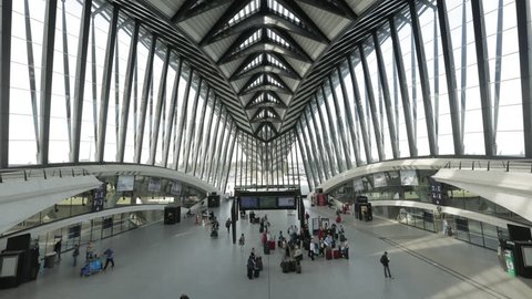 Lyon Saint-Exupery Airport. Hall of the TGV French High speed train inside the airport. Lots of travelers continue their travel by train after their plane.
