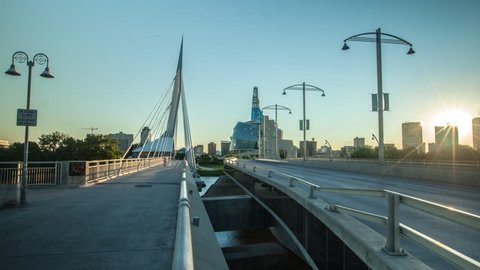 Winnipeg time lapse of gorgeous sunset over skyline while panning over Provencher Bridge.