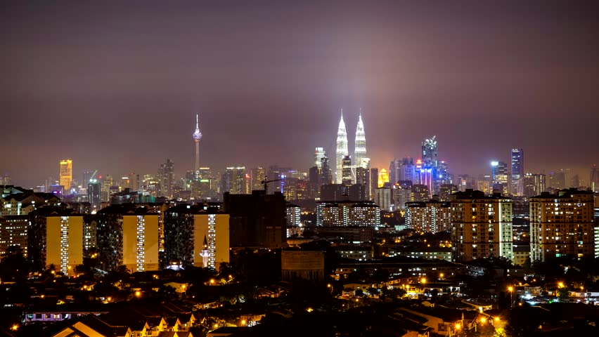 KUALA LUMPUR, MALAYSIA - 4TH JUNE 2014; Timelapse of night in Kuala Lumpur on June 4, 2014. Petronas Twin Towers are the tallest twin buildings in the world (451.9 m). | Shutterstock HD Video #12006209