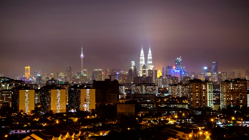 KUALA LUMPUR, MALAYSIA - 4TH JUNE 2014; Timelapse of night in Kuala Lumpur on June 4, 2014. Petronas Twin Towers are the tallest twin buildings in the world (451.9 m). | Shutterstock HD Video #12006212