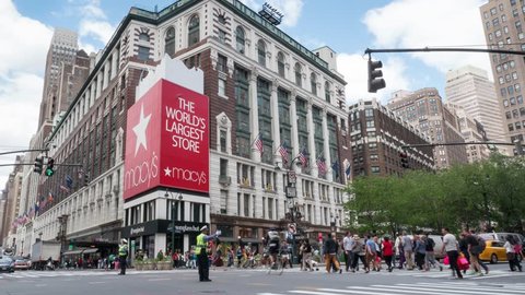 NEW YORK CITY - MAY 13, 2015: Historic Macy's Herald Square at 34th Street. Macy's is a mid-range chain of department stores owned by American multinational corporation Macy's, Inc. Time lapse video.