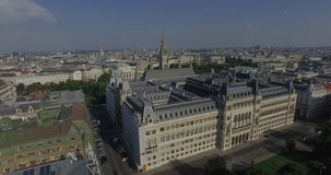 Aerial video. Rathaus Vienna - Town Hall & Rathauspark. Unusual view from from the back yard. Drone footage. 4K