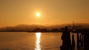 Video shot of a Seattle shipping yard at sunrise.
