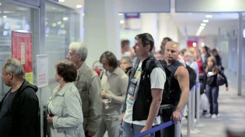 MONTENEGRO - PODGORICA 2012 - Passengers  waiting in line for buying tickets at the airport counter