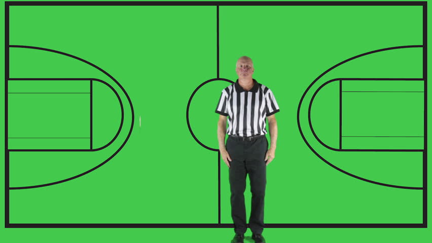 Man dressed in basketball referee uniform signaling Charging.
