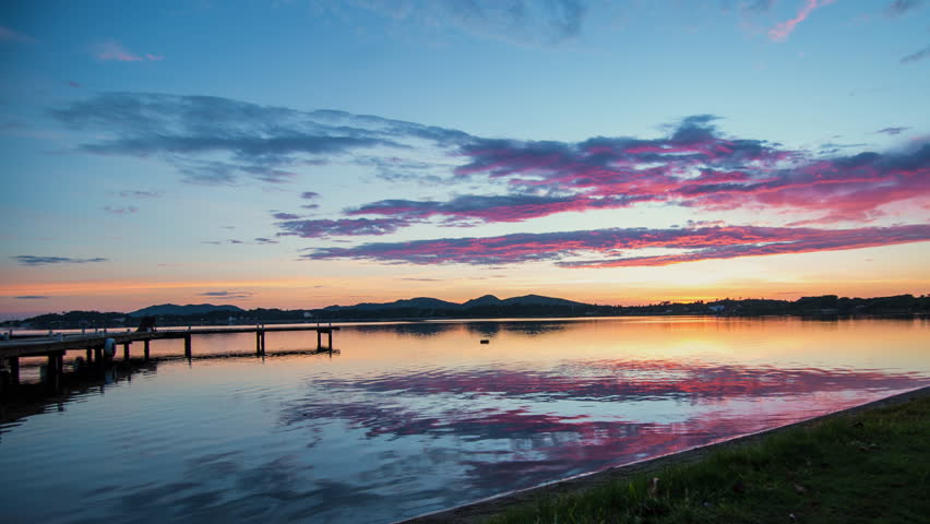 Time-lapse of a beautiful colorful sunrise at a lake. Very clear 4k image.