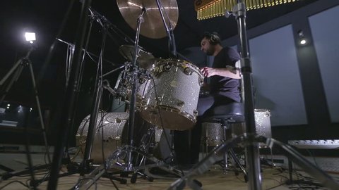 A drummer performing on his Drumset