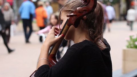 Street musicians in big city playing on instrument
