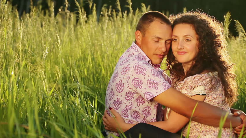 Happy couple in love look at camera