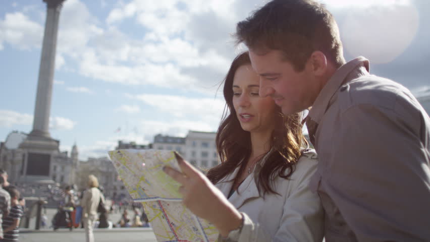 4K Attractive couple sightseeing in London, looking at map in Trafalgar Square. Shot on RED Epic. | Shutterstock HD Video #12042206