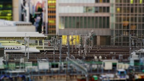 Elevated View in Tilt Shift Miniature Looks of Shinkansen Bullet Train arriving at Tokyo Station