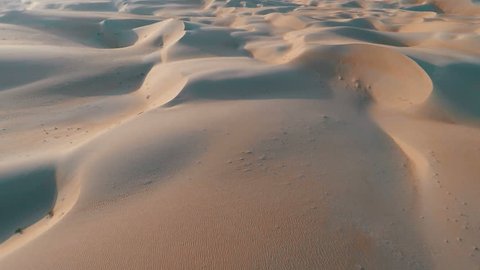 Endless rolling sand dunes aerial shot