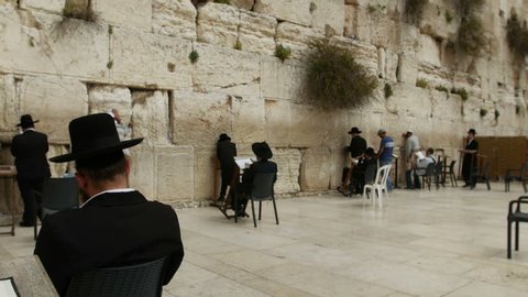 JERUSALEM, ISRAEL - April 10, 2015: Jerusalem western wall. The Western Wall or the Wailing Wall is the remaining wall of King Solomon temple where orthodox jews are praying. 