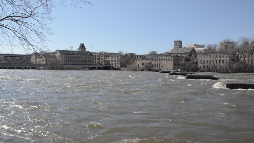 Appleton, WI, USA – April 18th, 2014: 
fox river flowing along banks of Appleton