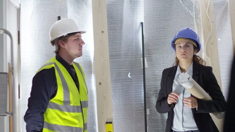 4k Confident female engineer or architect discussing construction issues with male colleagues. Shot on RED Epic.
