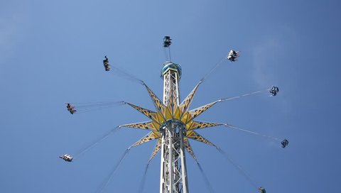 Flying swing in amusement park Stock Video