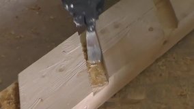 Man causes epoxy adhesive on the Board, manufacturing of wooden stairs