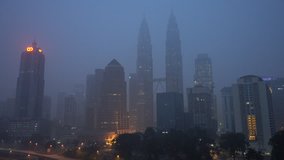 4k footage. Kuala Lumpur city in the morning sunrise during severe haze. Pan left.